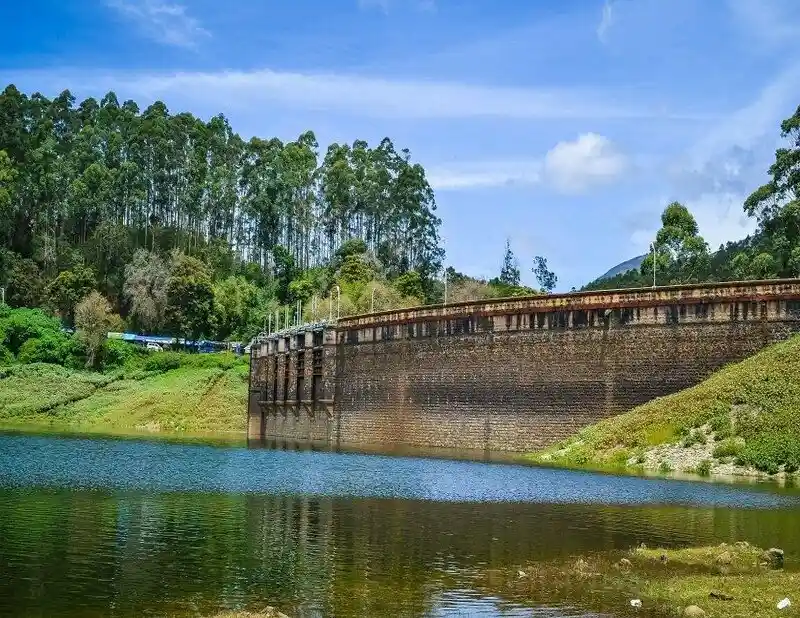 The peaceful waters of Kundala Dam amidst the scenic landscape