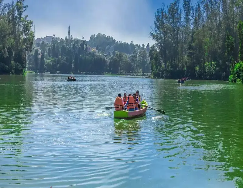 view of Ooty Lake surrounded by lush green hills